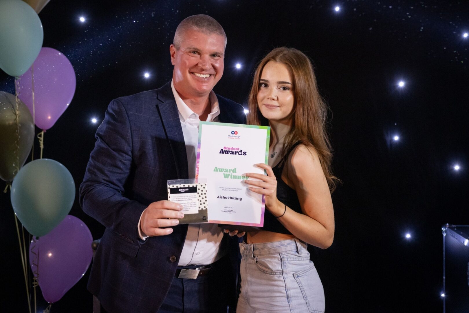 Gary Potts Of MC With Travel Student Winner Aisha Huizing