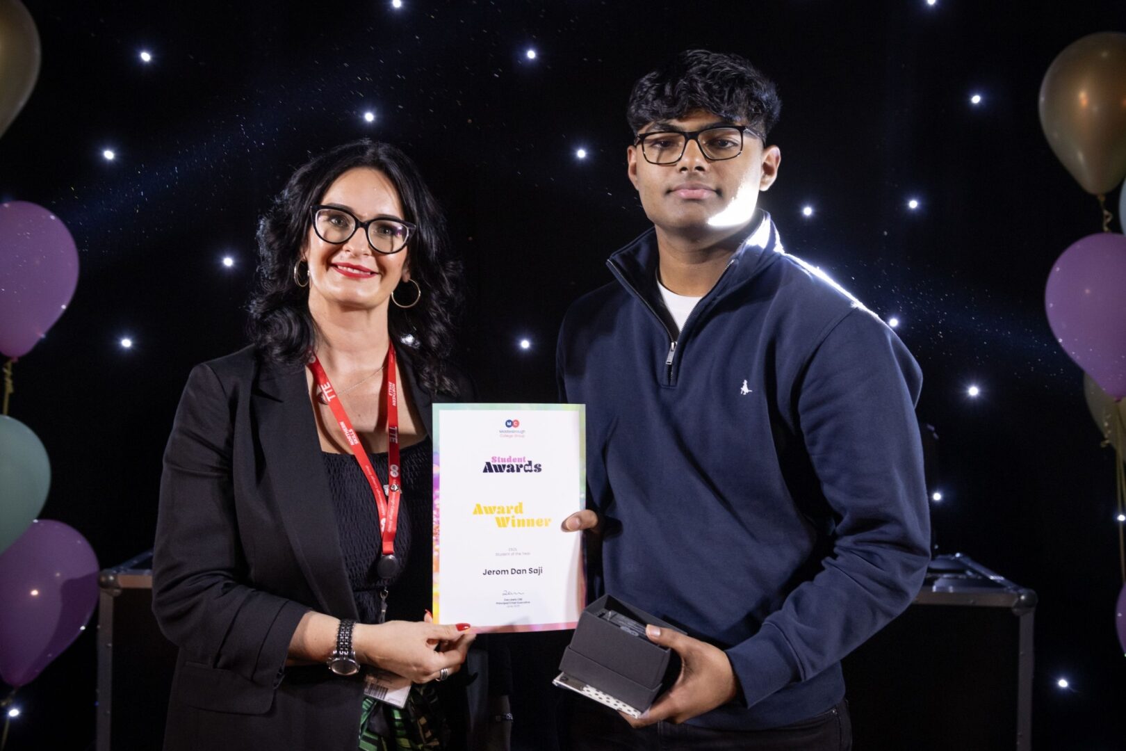 Rachel Gray Of MC With ESOL Student Winner Jerom Dan Saji
