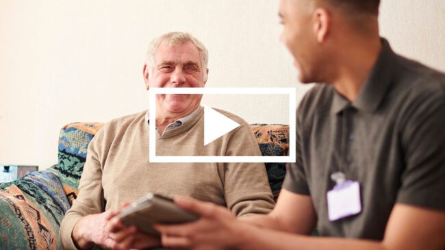 Social carer with elderly man