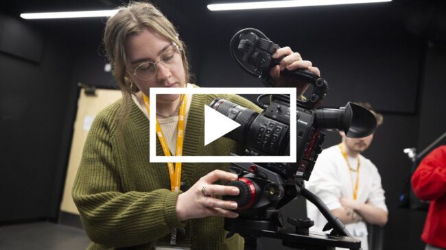 Media student with camera