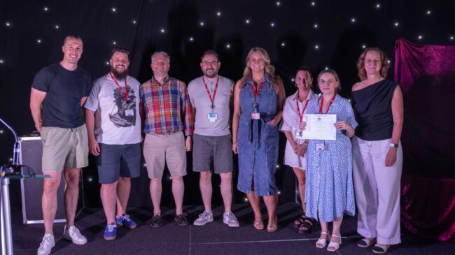 Teaching and Learning Team collect award