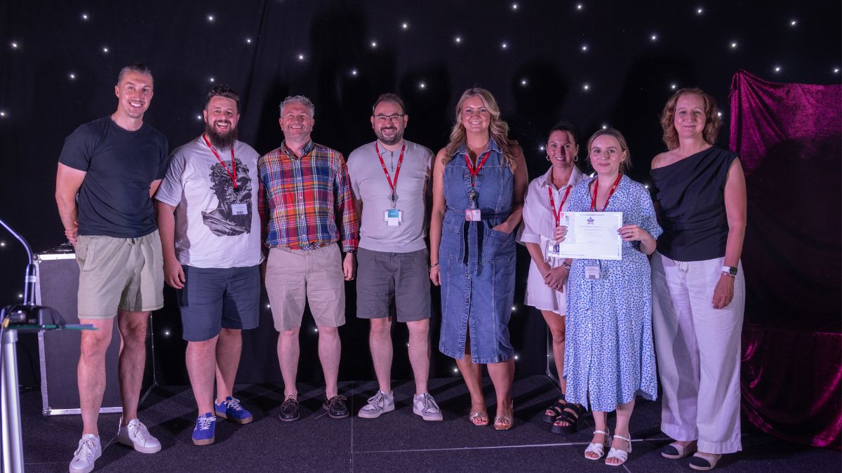Teaching and Learning Team collect award