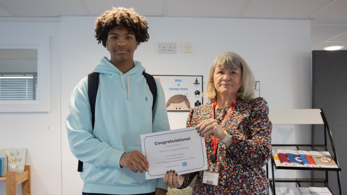 Tina Lucas presents certificate to A Level Law student