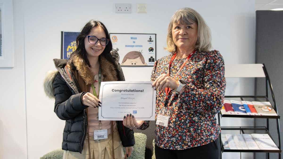 Tina Lucas presents certificate to A Level Law student
