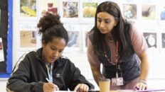 Adult learner and tutor in classroom