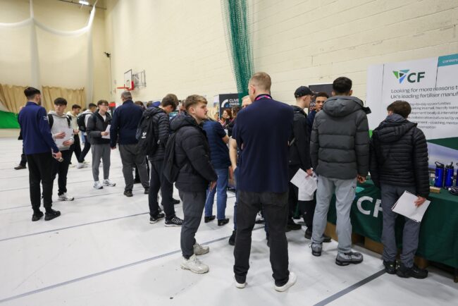 Students speak with employers