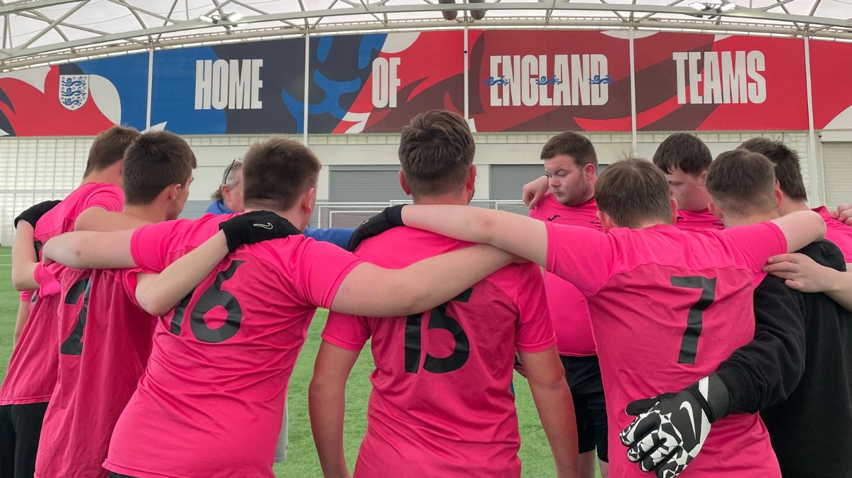 The MC team huddle up before a match
