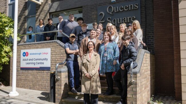 Rachel Gray with learners and staff of the ROOTS Programme outside 2 Queens Square