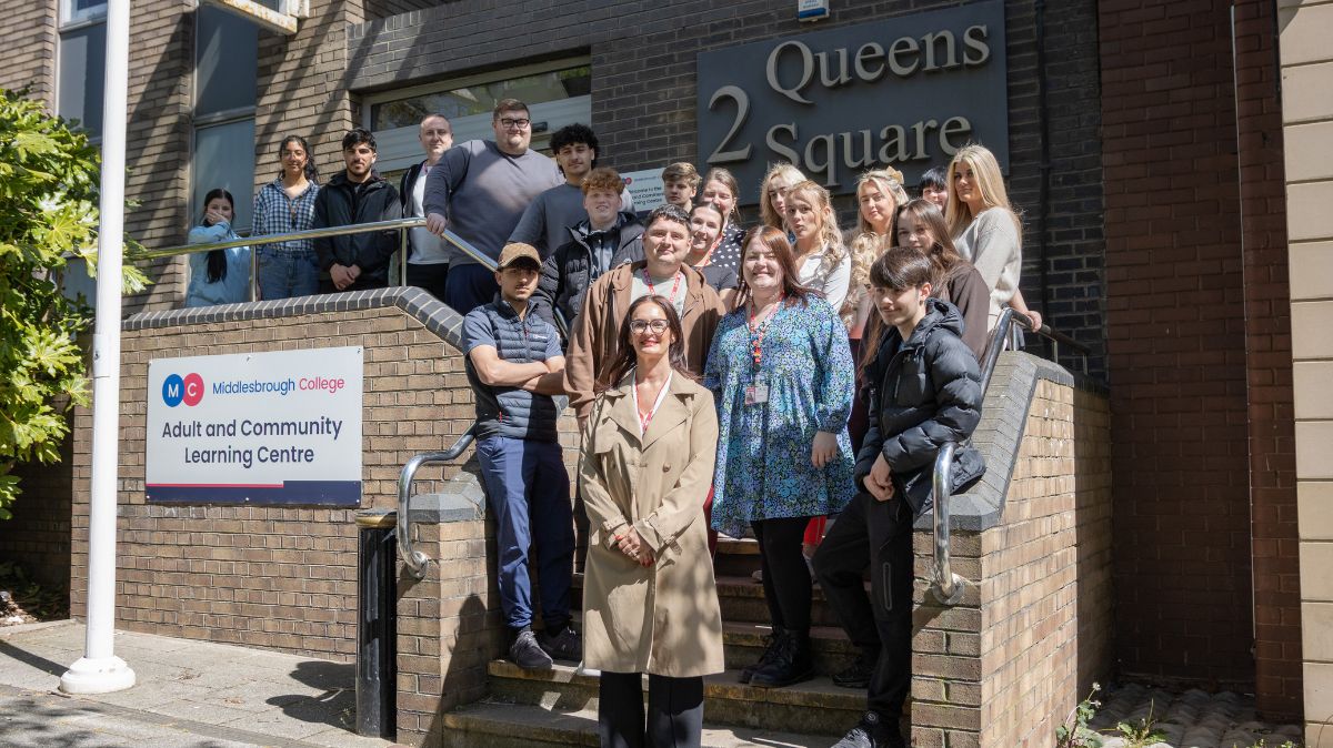 Rachel Gray with learners and staff of the ROOTS Programme outside 2 Queens Square