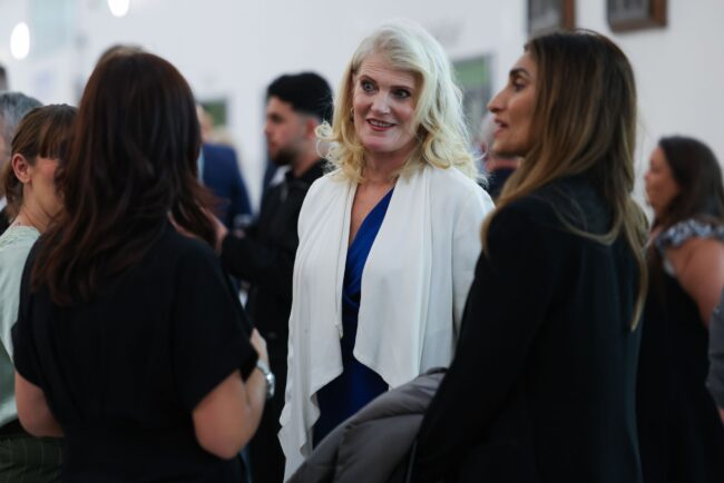 Claire Preston and Yasmin Khan chat with staff before the awards start