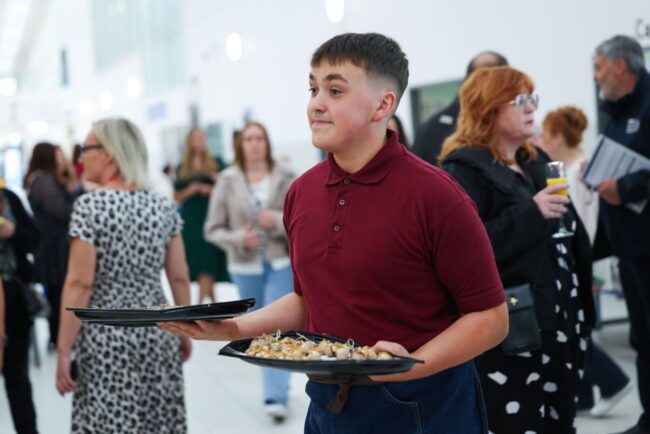 Catering and Hospitality students serve canapes to guests