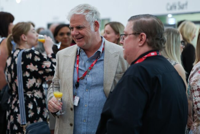 Jamie Hunter mingles will colleague