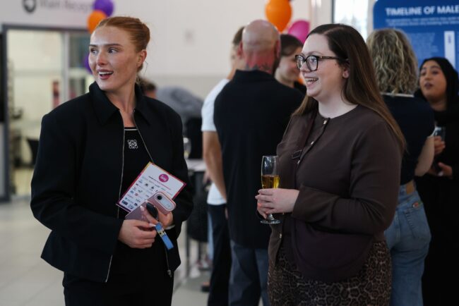 Muckle LLP representatives mingle