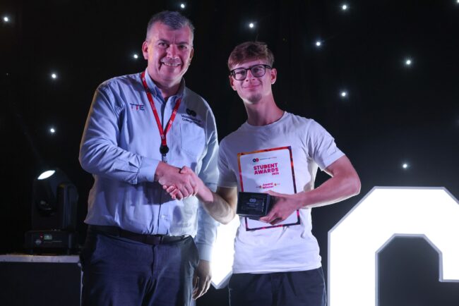 On behalf of Steel Benders,Associate Director John Cooke, with TTE Mechatronics Student of the Year, Brandon Theakston