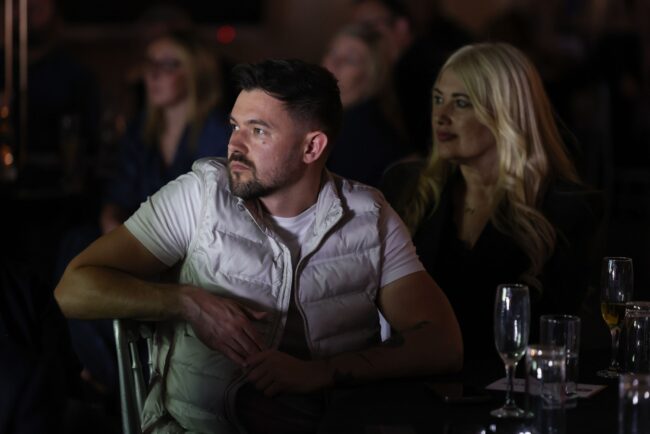 Southern Assets Management representatives watch the award