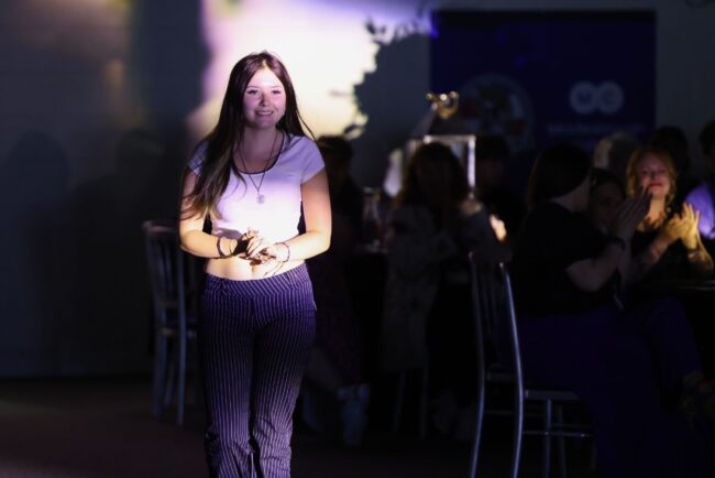 Overall Student of the Year, Isobel Wilson, walks to the stage to collect her award