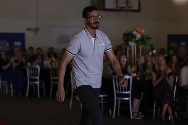 Overall Adult Learner of the Year, Mohammed Alanizi, walks to the stage to collect his award