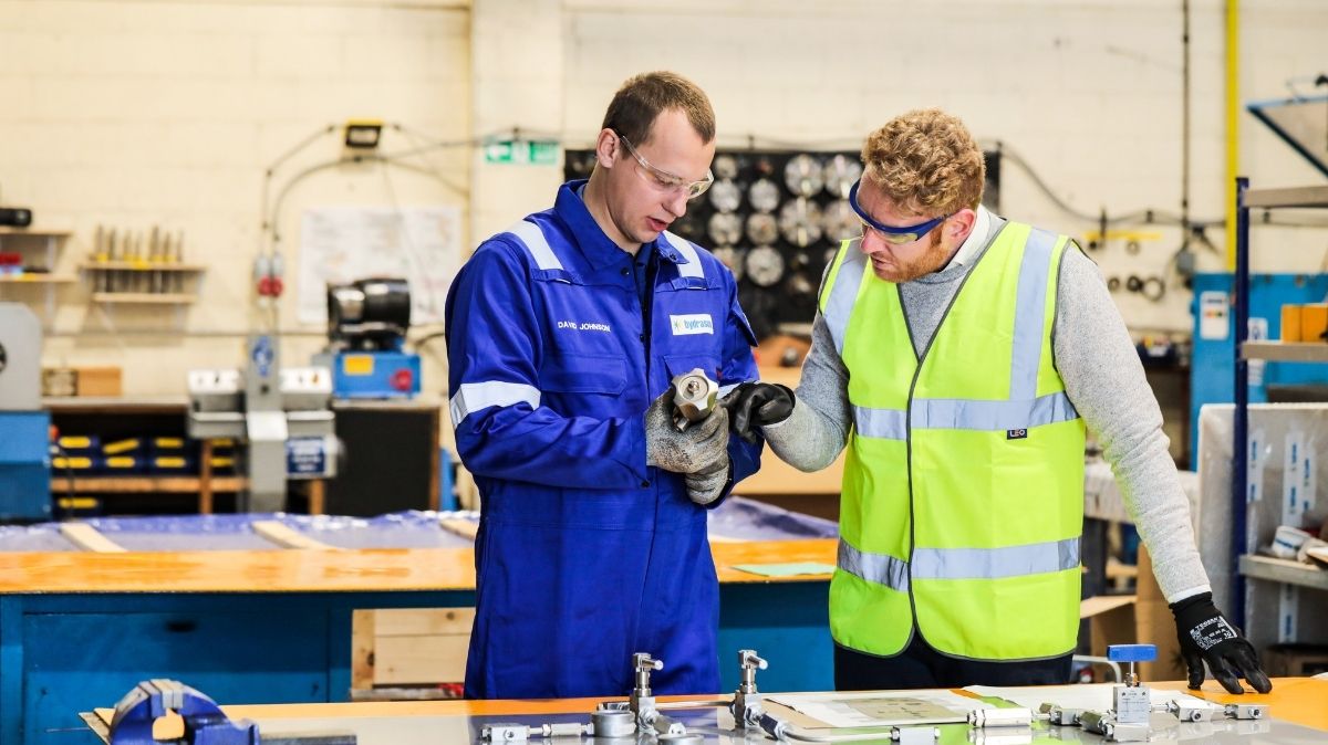 Apprentice and Employer in workshop