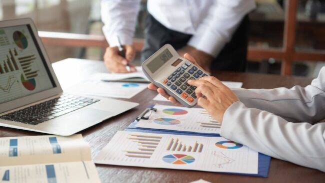 Accountants with a calculator