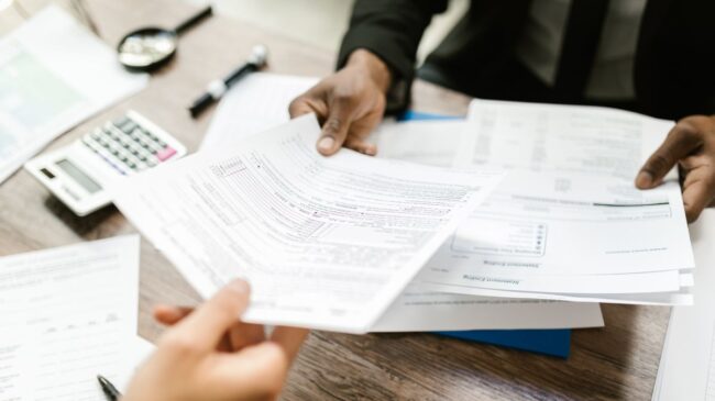 Hands holding papers