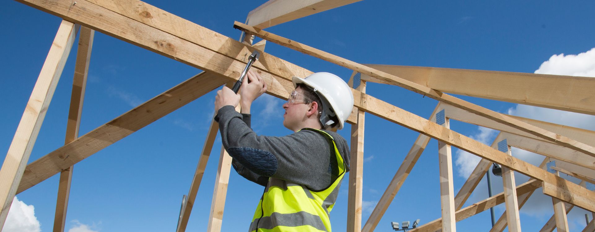 Construction student working on wooden frame